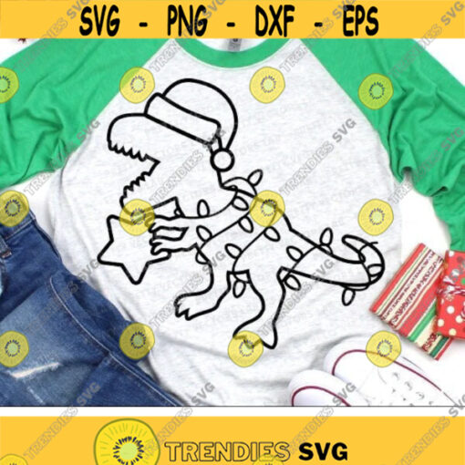 Christmas Dinosaur Svg Santa T Rex Outline Cut Files Funny Dino with Lights Svg Dxf Eps Png Kids Shirt Design Winter Silhouette Cricut Design 3213 .jpg