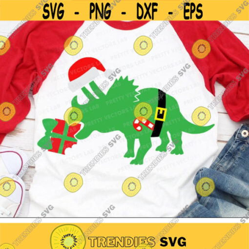 Christmas Dinosaur Svg Triceratops Svg Santa Dino Svg Kids Holiday Svg Dxf Eps Png Funny Xmas Cut Files Baby Clipart Silhouette Cricut Design 1647 .jpg